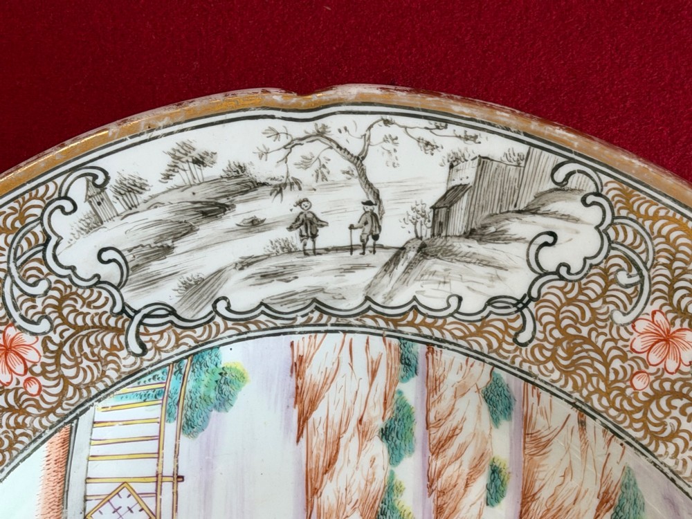 An oval Coalport porcelain meat platter decorated with hand-painted oriental figures in a landscape surrounded by a floral and gilded border. View VI