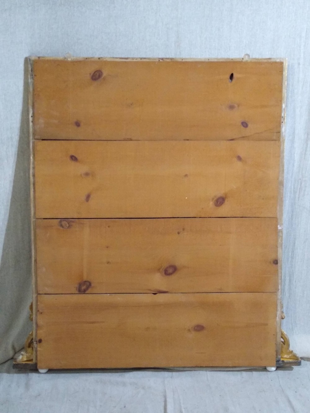 A rectangular Victorian overmantel mirror featuring a gilt frame with side scroll brackets and shaped upper inner corners. View III
