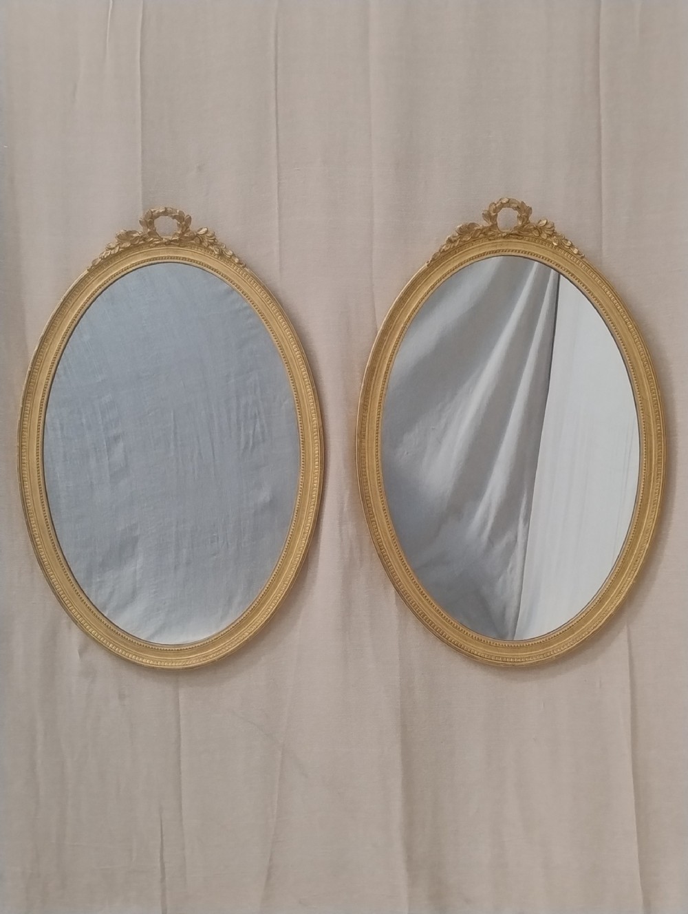 A Fine Pair of Giltwood Oval Mirrors c 1890