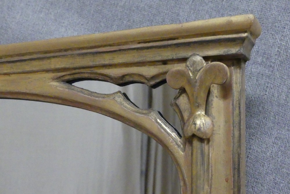 A large late 19th-century rectangular giltwood overmantel mirror featuring an arched inner frame with spandrel detailing. View V