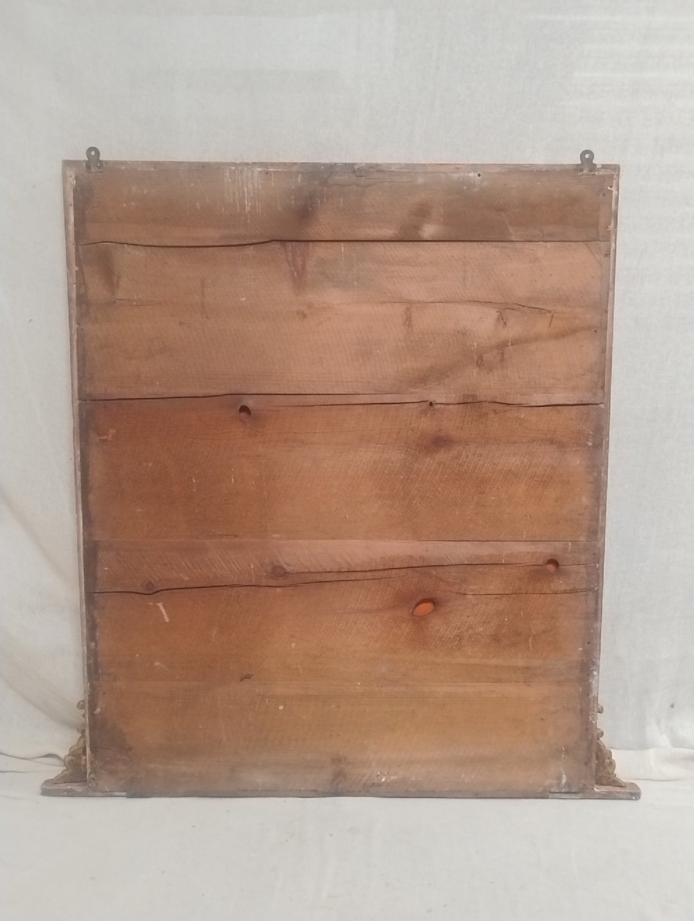 A large rectangular antique gilt overmantel mirror featuring rounded upper corners, moulded frame, and carved acanthus scroll feet at the base. View II
