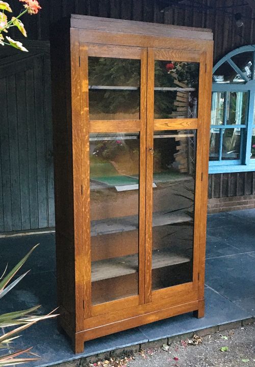 A tall, glazed Art Deco oak bookcase