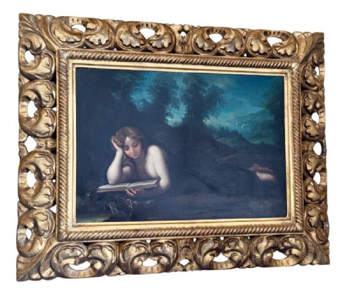 fig 4. An oil painting of Mary Magdalen reclining in a landscape while reading a book, set within a carved gilt frame.