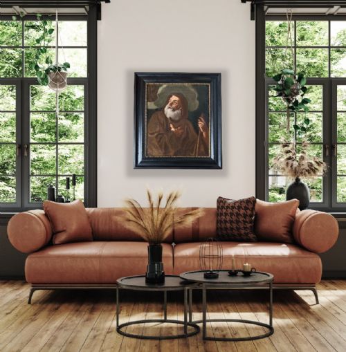 fig 2. An oil painting depicting Saint Francis of Paola looking upwards while holding a staff, set within a dark moulded frame.