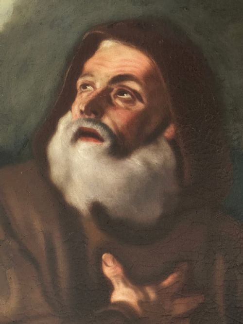 fig 4. An oil painting depicting Saint Francis of Paola looking upwards while holding a staff, set within a dark moulded frame.