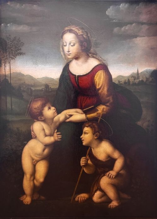 fig 1. An 18th-century oil painting depicting the Virgin Mary with the Christ Child and infant Saint John the Baptist in a landscape, presented in a carved giltwood frame.