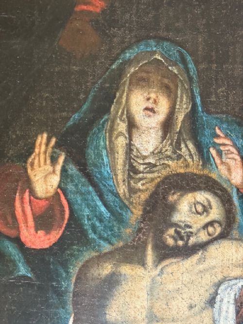fig 5. An early 17th-century oil painting depicting the Lamentation of Christ with surrounding figures in draped garments, set within an ornate carved gilt frame.