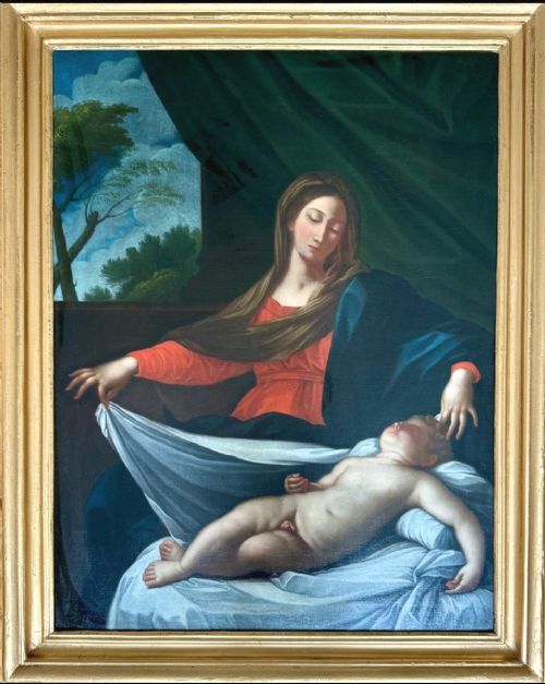 fig 4. An antique oil painting depicting the Adoration of the Shepherds with Mary, Joseph, and the infant Jesus in an inlaid wood frame.