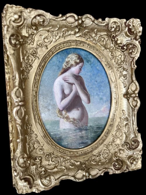fig 2. An oval Victorian oil painting depicting a mythological blonde Nereid emerging from sea water, set within a heavily carved rectangular gold gilt frame.