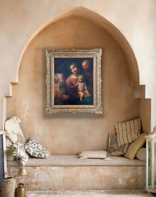 fig 2. An antique oil painting depicting the Holy Family with Saint Jerome set within an ornate carved gilded frame.