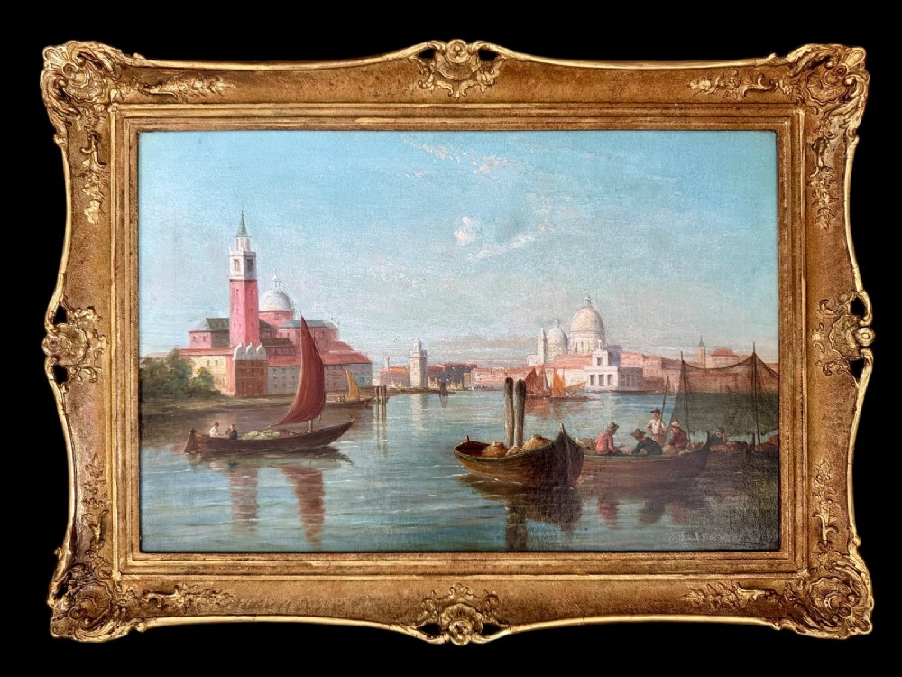 An antique oil painting depicting sailing vessels on the Grand Canal in Venice within an ornate gilded frame.