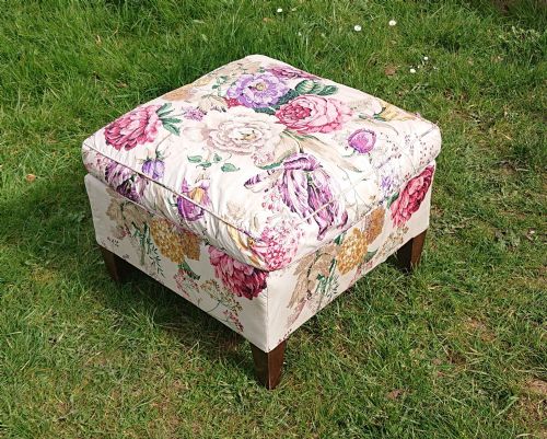 CUSHION TOP FOOTSTOOL IN THE MANNER OF HOWARD AND SONS