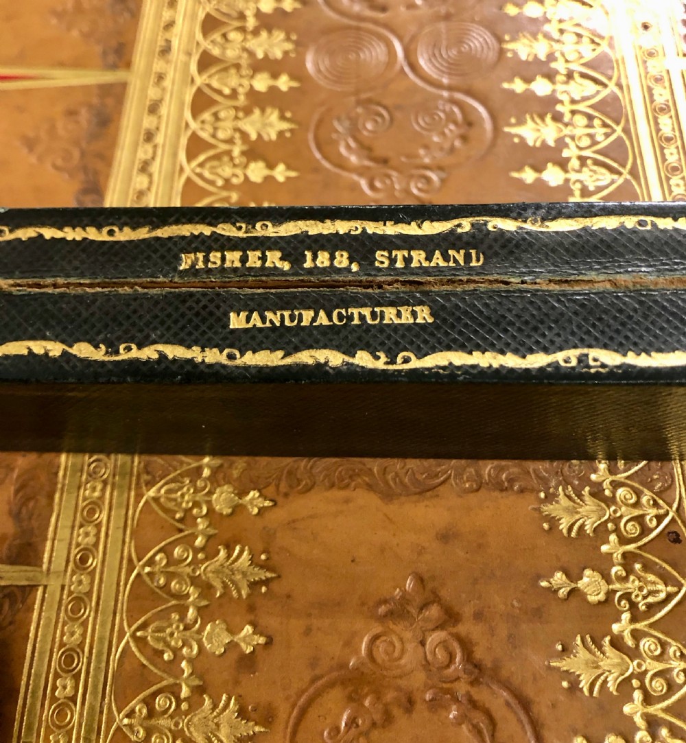 Two late nineteenth-century folding games boards fashioned as double-volume leather-bound books with gilt-tooled spines and chessboard playing tops. View VII