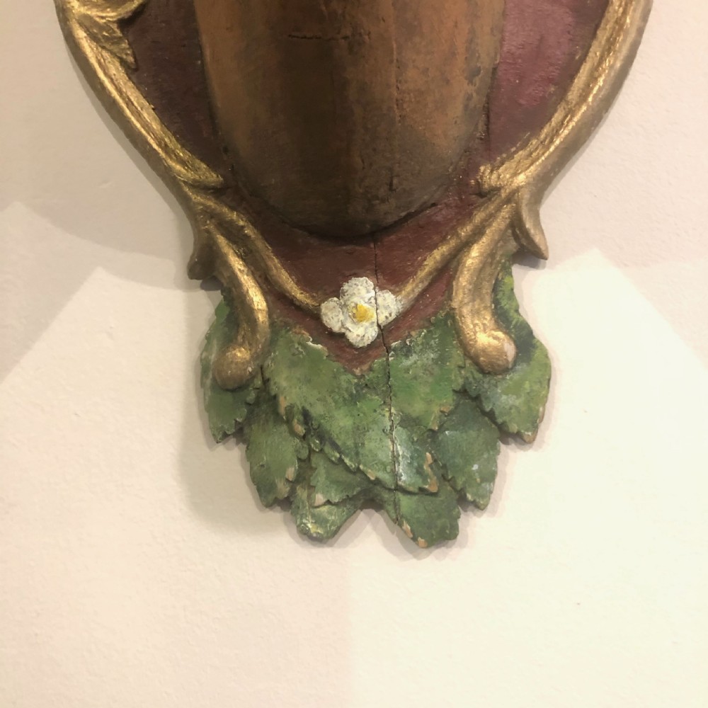 A late 19th-century Swedish hand-painted carved wood deer head with natural antlers mounted on an ornate heart-shaped plaque decorated with foliage motifs. View VIII
