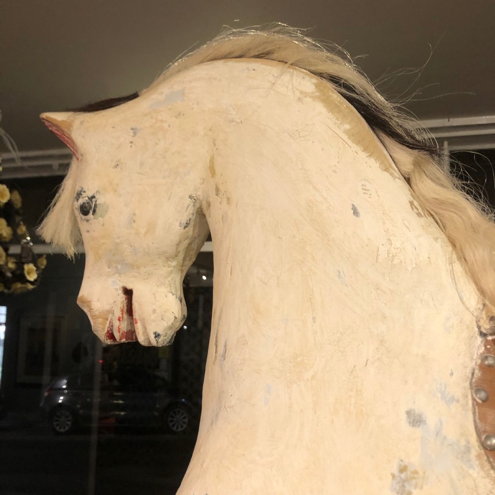 LARGE CARVED WOODEN ROCKING HORSE. View II