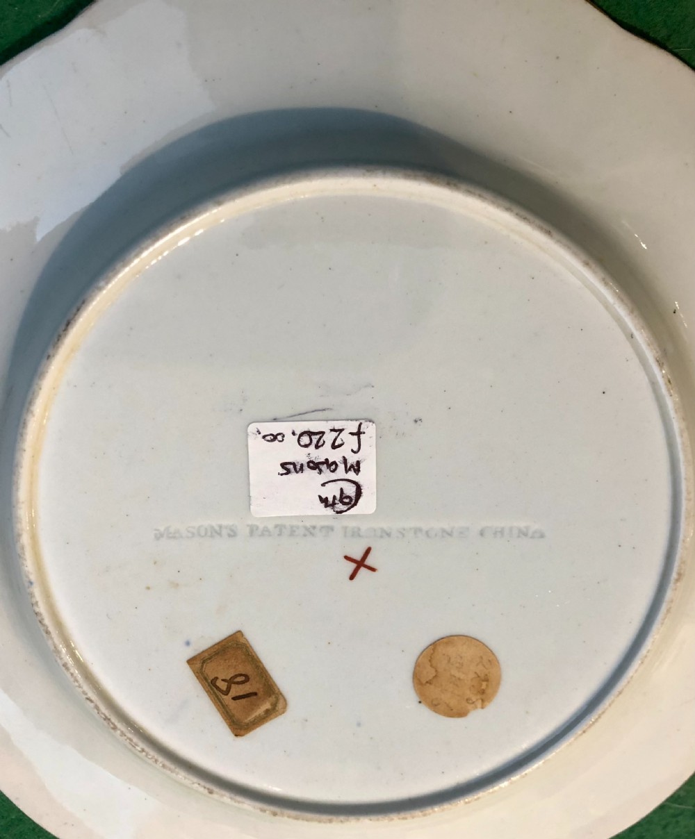An antique Masons Patent Ironstone plate featuring hand-painted floral motifs in iron red and cobalt blue with a scalloped gilded rim. View III