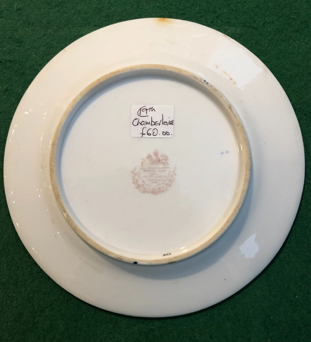An antique circular porcelain dessert plate decorated with a Japanese-inspired Imari pattern in cobalt blue, terracotta red, and hand-gilded detail. View IV