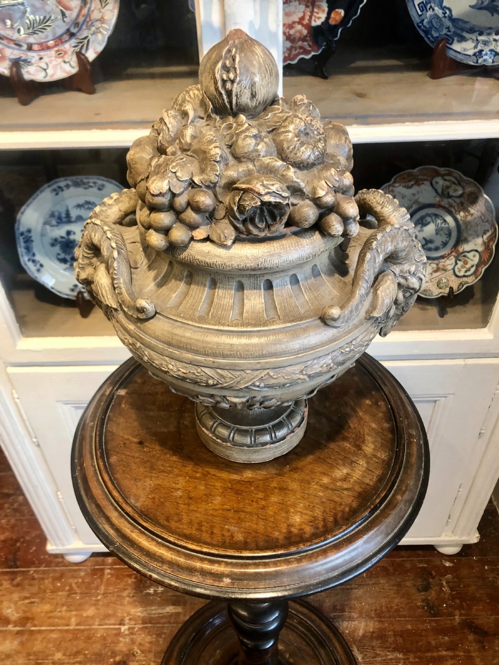 An 18th-century Georgian mahogany pedestal featuring a barley twist column, ebonised turnings, and a heavy circular moulded base. View III