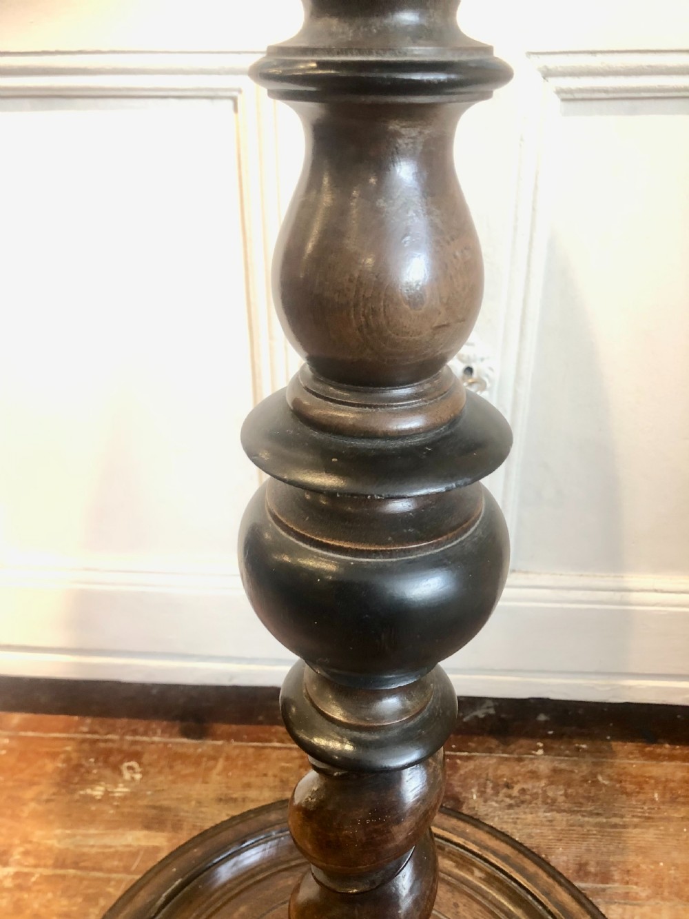 An 18th-century Georgian mahogany pedestal featuring a barley twist column, ebonised turnings, and a heavy circular moulded base. View VI