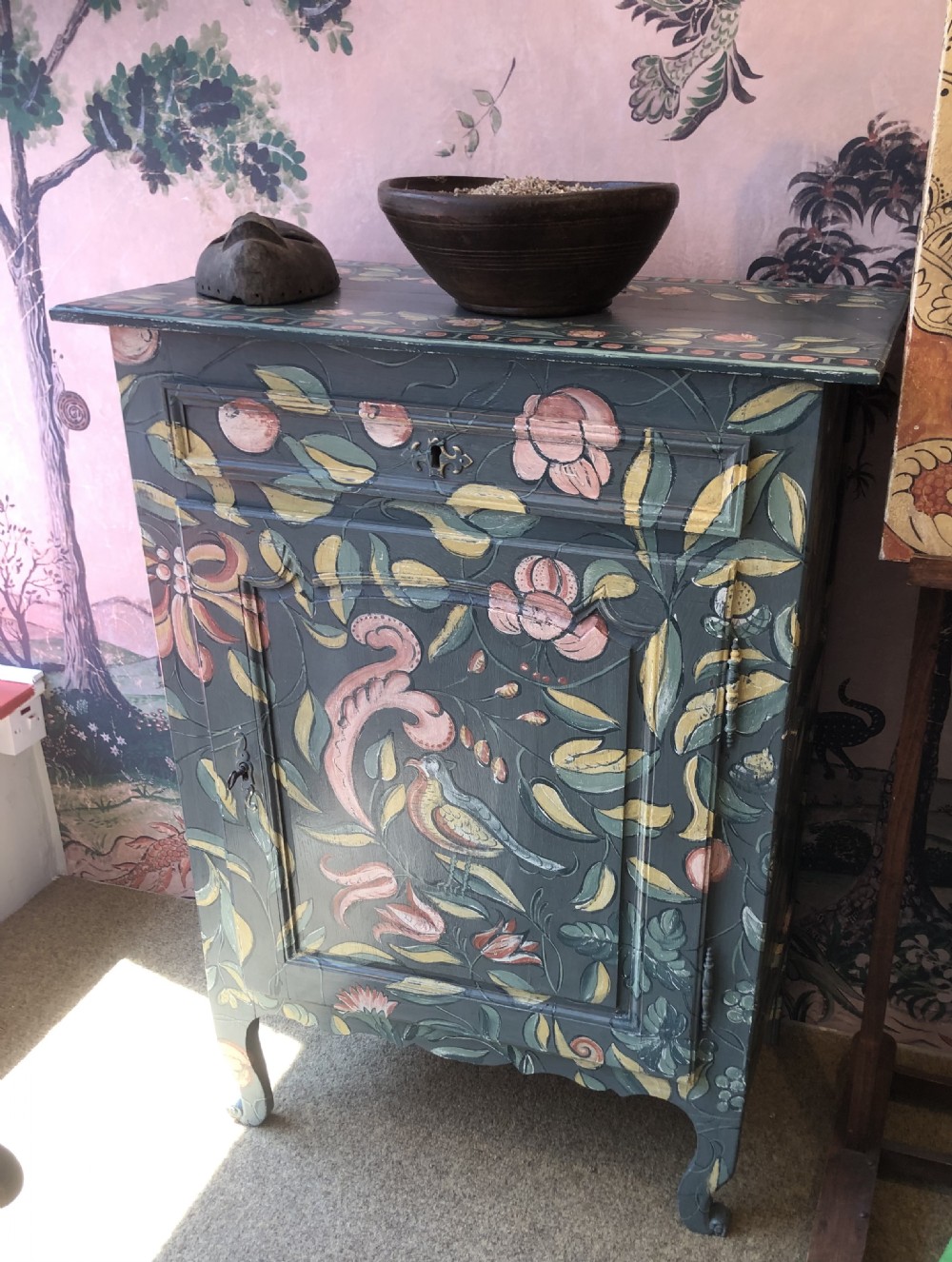 A hand-painted dark green French single-door wooden cupboard decorated with botanical foliage and bird motifs. View II