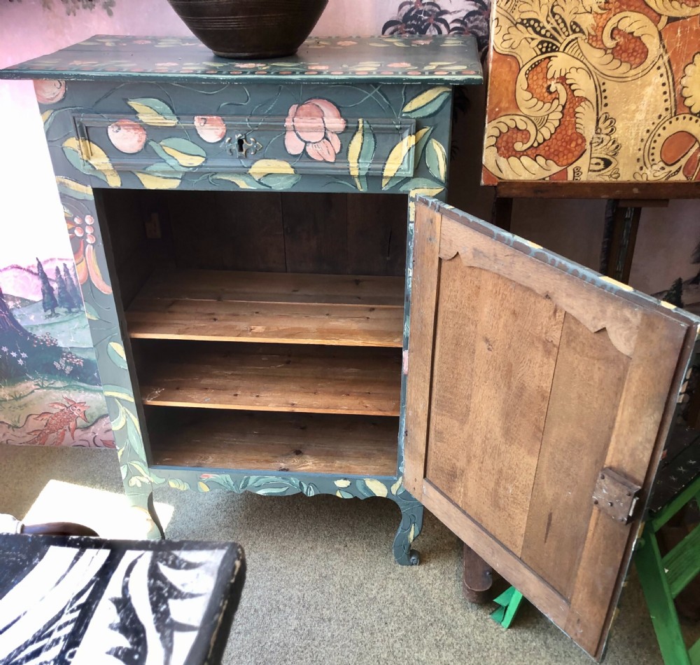 A hand-painted dark green French single-door wooden cupboard decorated with botanical foliage and bird motifs. View V