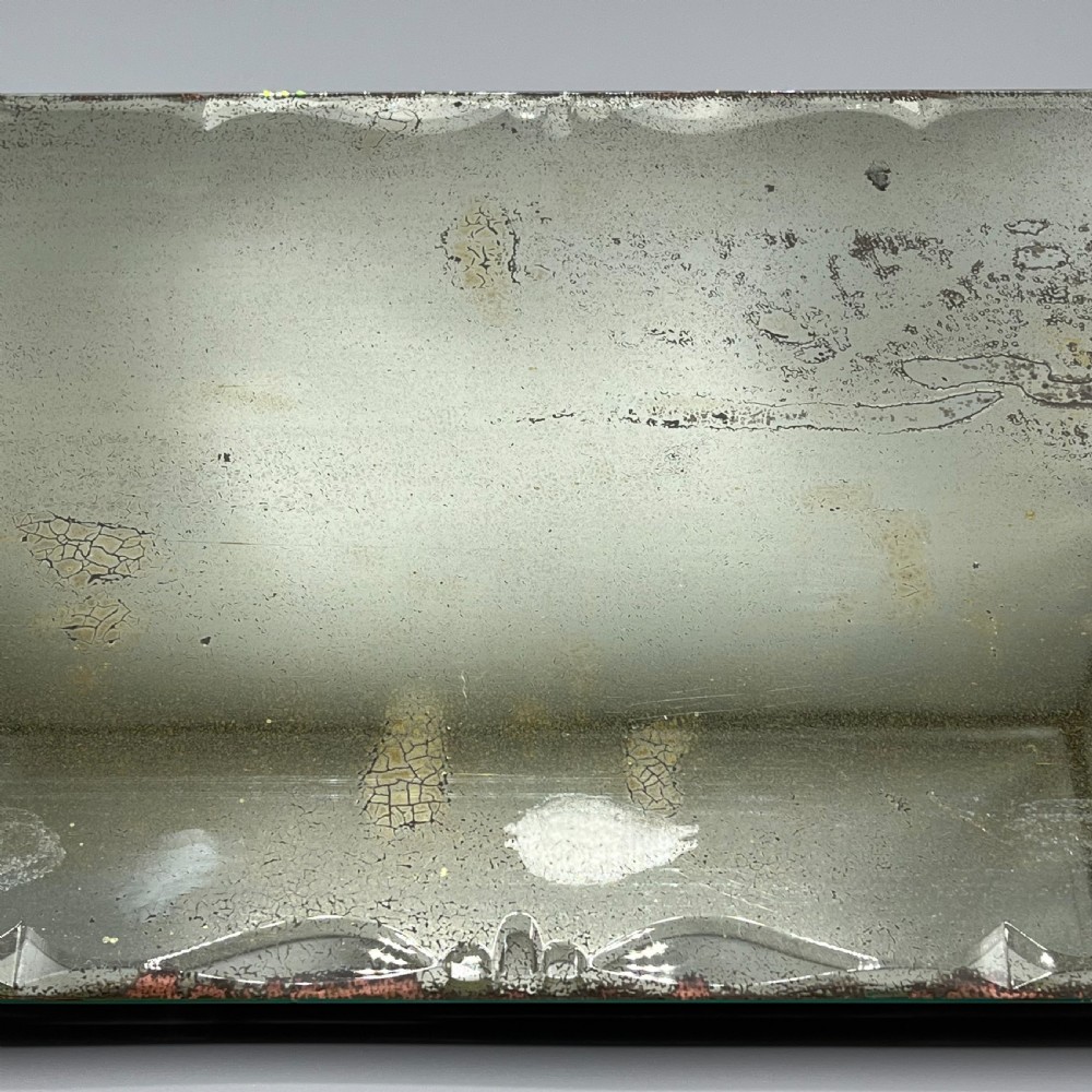 A rectangular Art Deco mirrored glass tray featuring cut decorative edges and rolled copper handles supported by small footings. View VIII