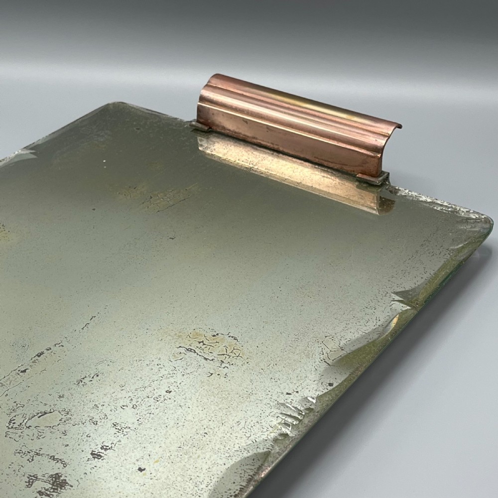 A rectangular Art Deco mirrored glass tray featuring cut decorative edges and rolled copper handles supported by small footings. View XI