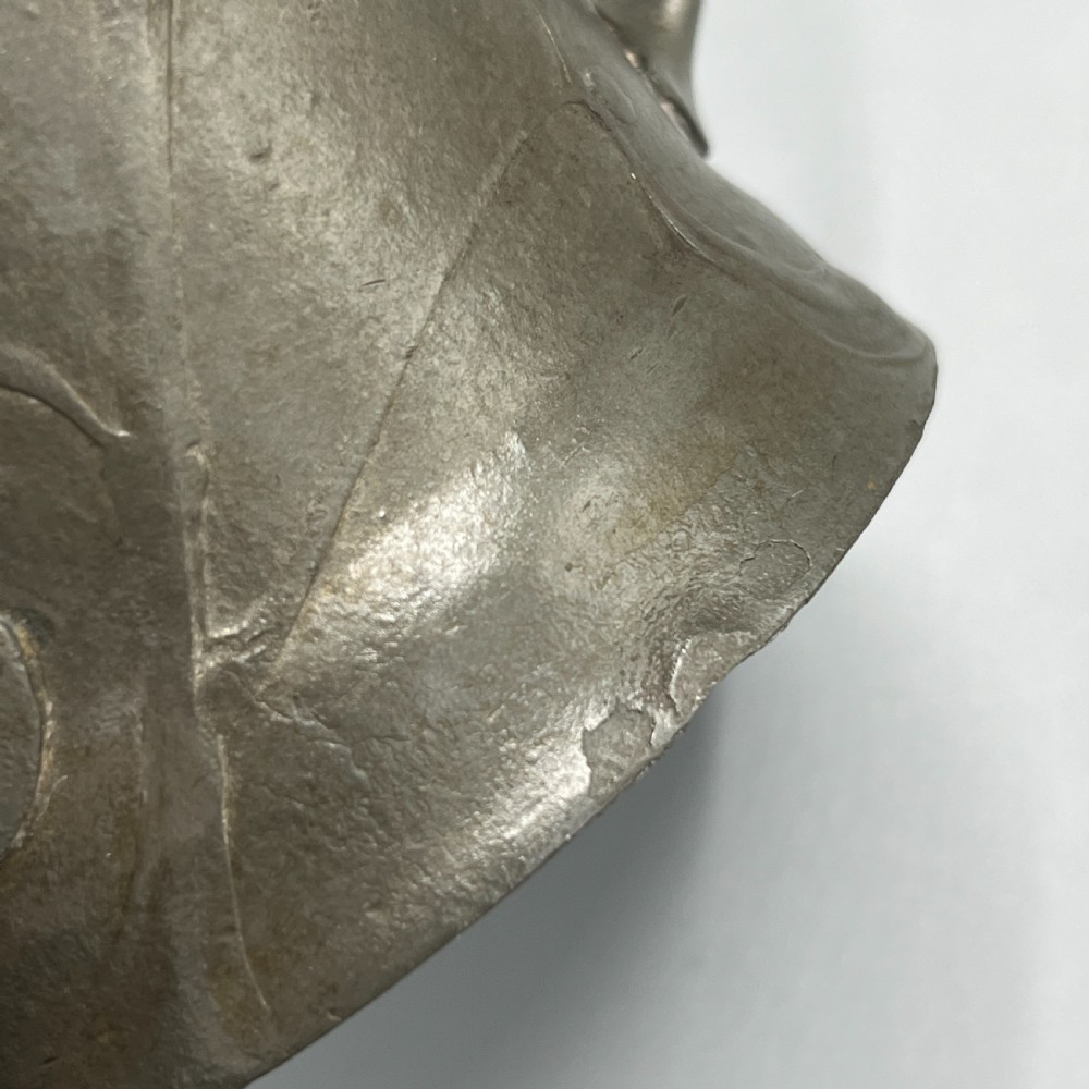 A grey pewter Art Nouveau tyg vase featuring three curved handles and relief-moulded mistletoe motifs around the body. View XV