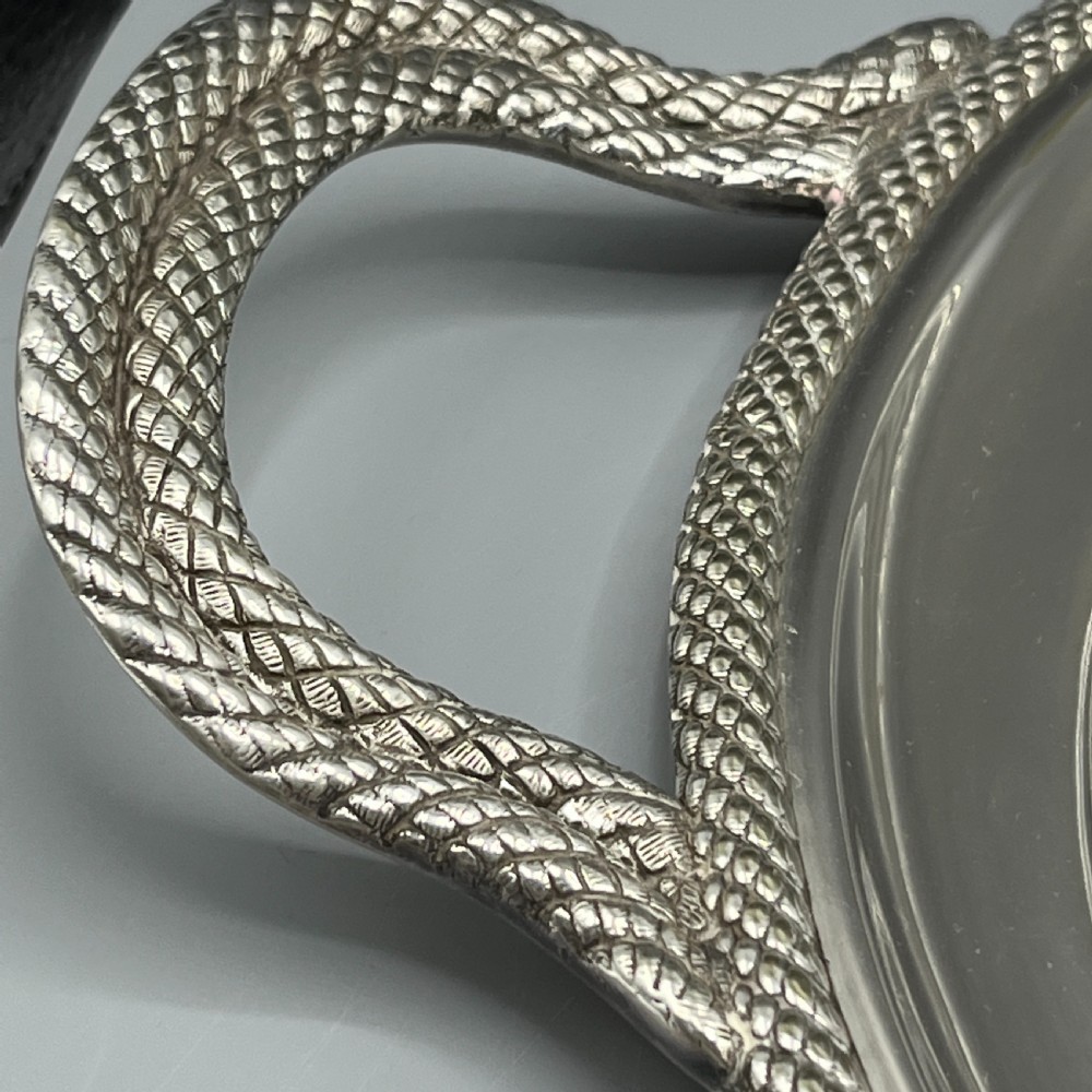 A large Victorian oval silver-plated serving tray featuring twin carrying handles, a textured rope border, and elaborate floral central engraving. View VII