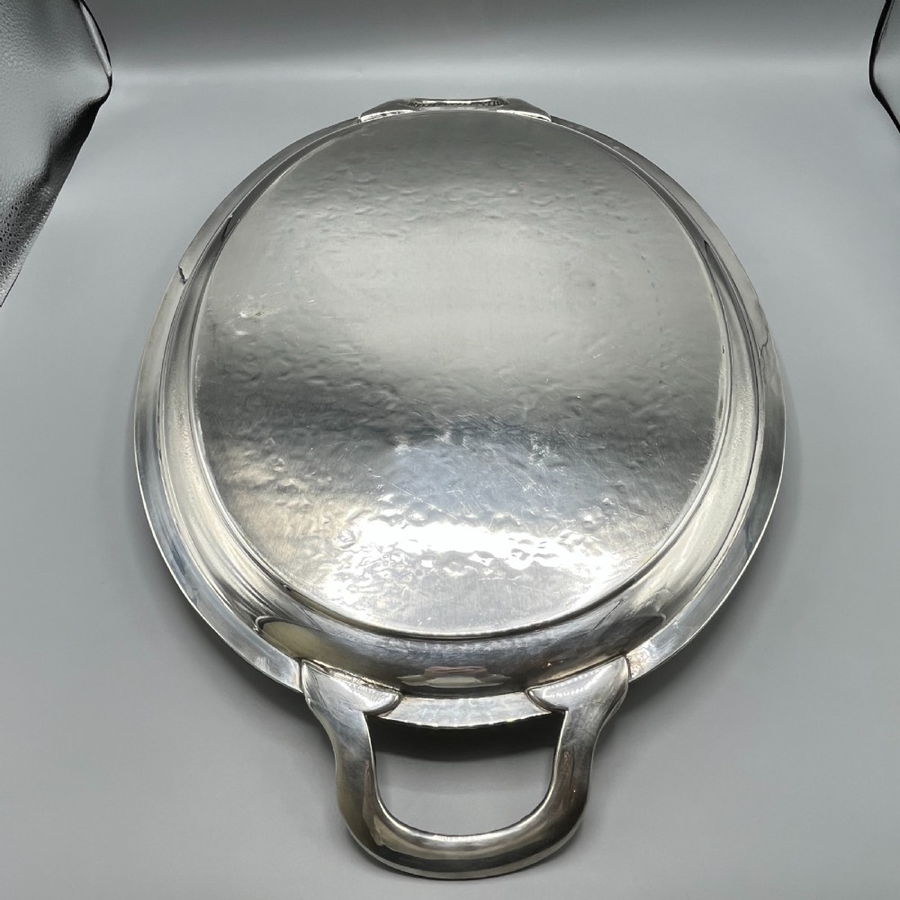 A large Victorian oval silver-plated serving tray featuring twin carrying handles, a textured rope border, and elaborate floral central engraving. View XIX