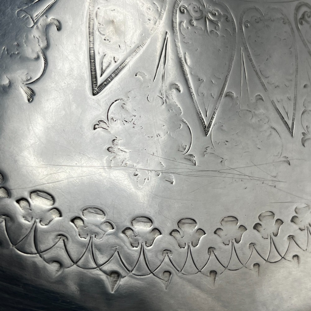 A large Victorian oval silver-plated serving tray featuring twin carrying handles, a textured rope border, and elaborate floral central engraving. View XXI