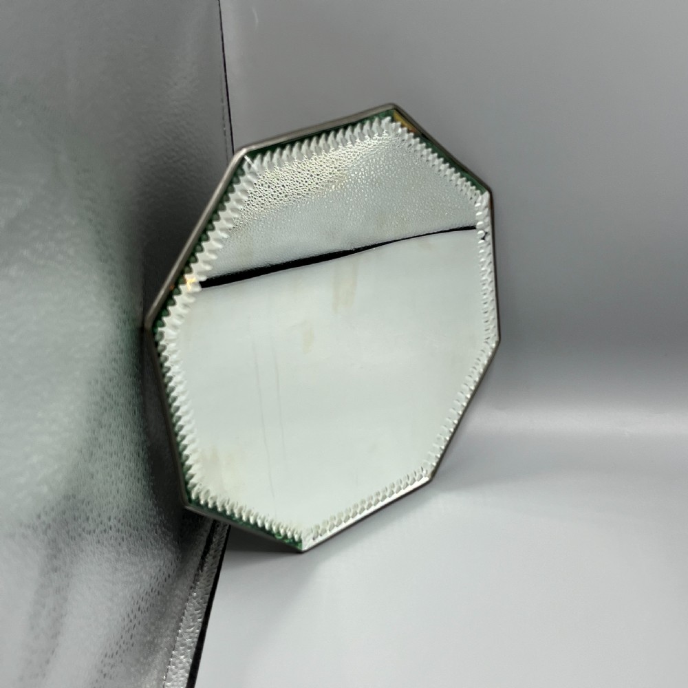 An octagonal frameless mirror featuring a decoratively cut bevelled interior border pattern on a clear mirrored surface. View III