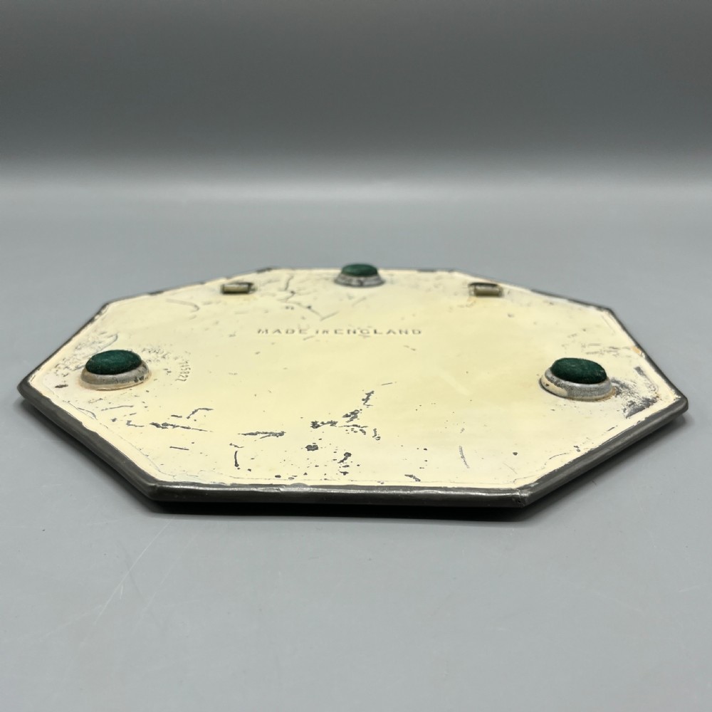 An octagonal frameless mirror featuring a decoratively cut bevelled interior border pattern on a clear mirrored surface. View XIV