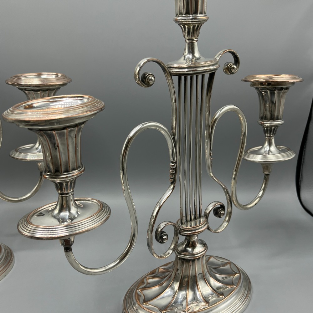 A pair of Georgian silver-plated three-light candelabra with lyre-shaped columns and scrolling branches. View VI