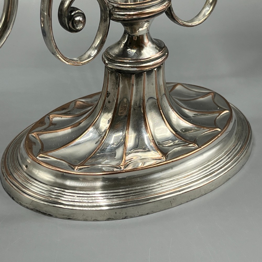 A pair of Georgian silver-plated three-light candelabra with lyre-shaped columns and scrolling branches. View VII