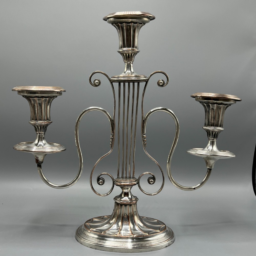 A pair of Georgian silver-plated three-light candelabra with lyre-shaped columns and scrolling branches. View VIII