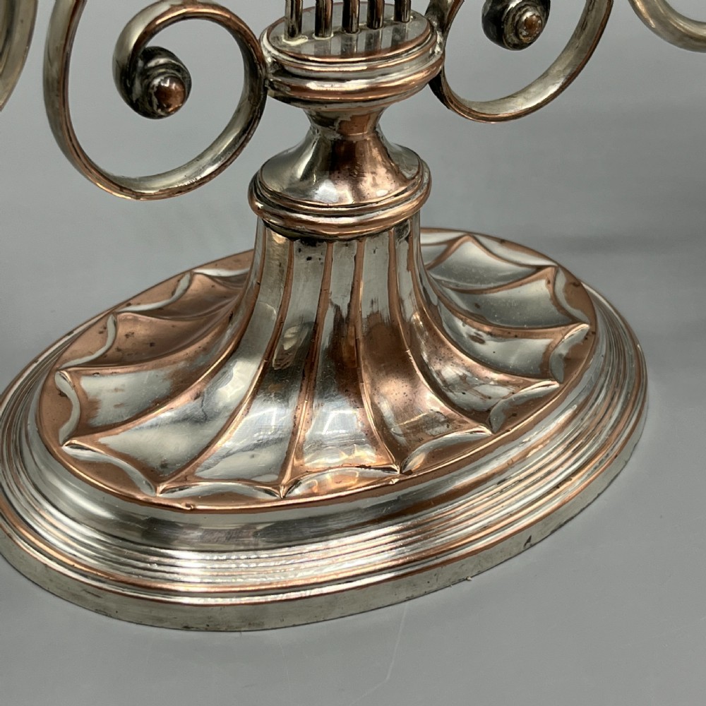 A pair of Georgian silver-plated three-light candelabra with lyre-shaped columns and scrolling branches. View XI