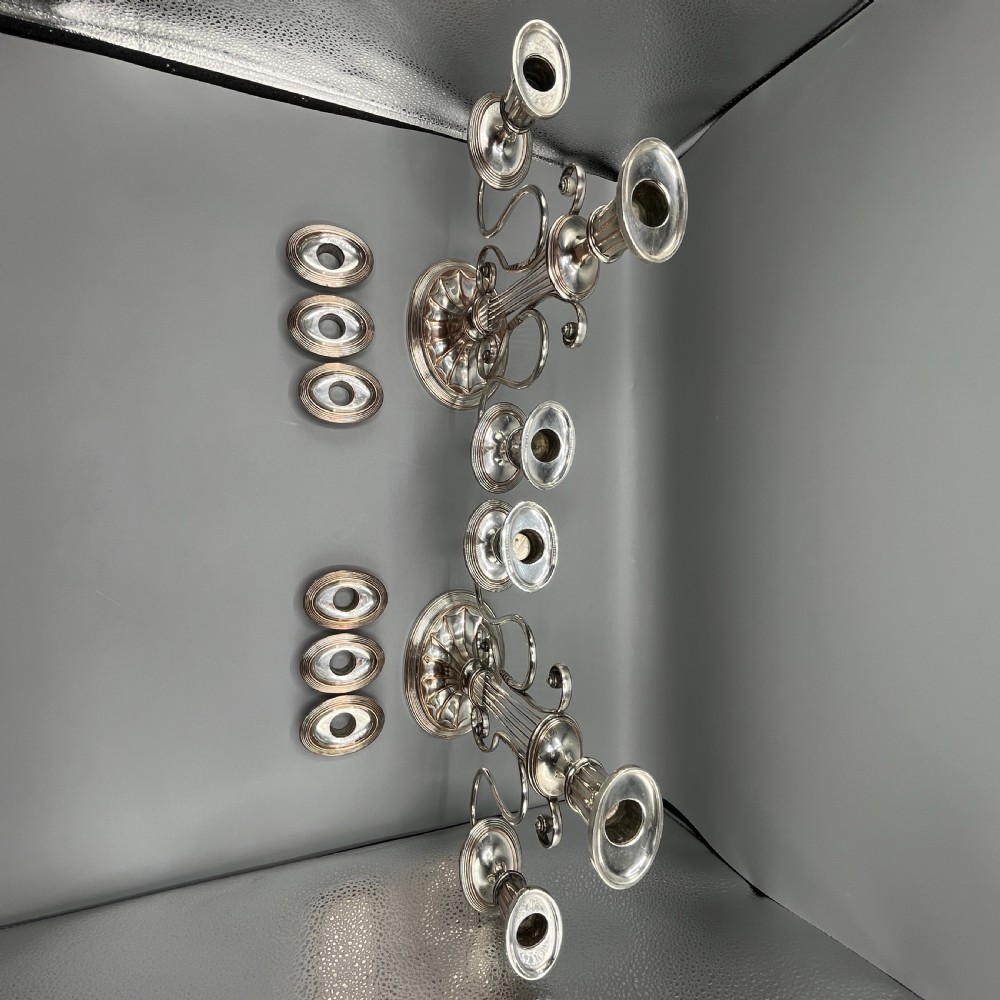 A pair of Georgian silver-plated three-light candelabra with lyre-shaped columns and scrolling branches. View XVIII