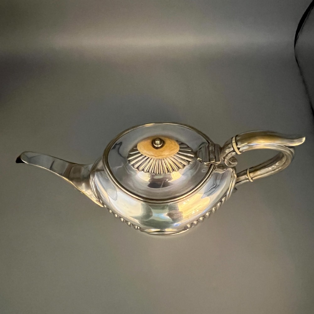 A four-piece Victorian silver-plated tea and coffee set featuring a teapot, coffee pot, sugar bowl, and cream jug with fluted bodies and pedestal bases. View XIV