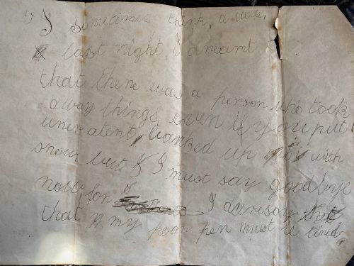 fig 1. A folded 19th-century handwritten letter on creased cream paper with cursive script and a red Queen Victoria halfpenny postage stamp.