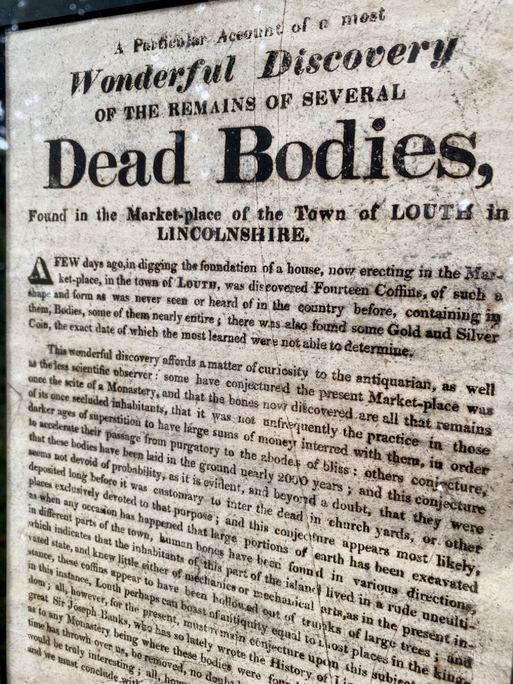 An 1823 letterpress printed broadside notice titled regarding a discovery in Louth Lincolnshire, presented in a dark ebonised wooden frame. View II