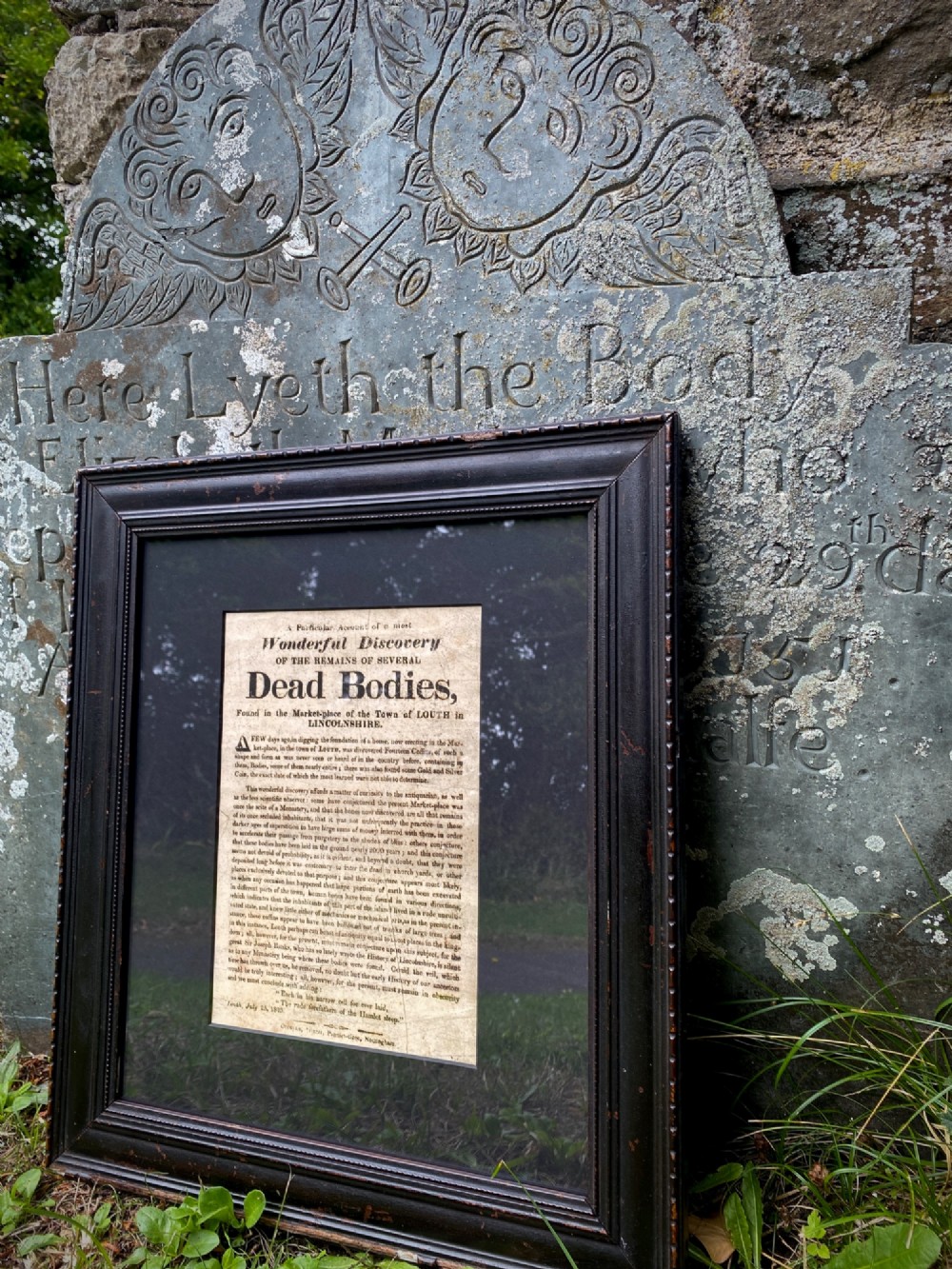 An 1823 letterpress printed broadside notice titled regarding a discovery in Louth Lincolnshire, presented in a dark ebonised wooden frame.