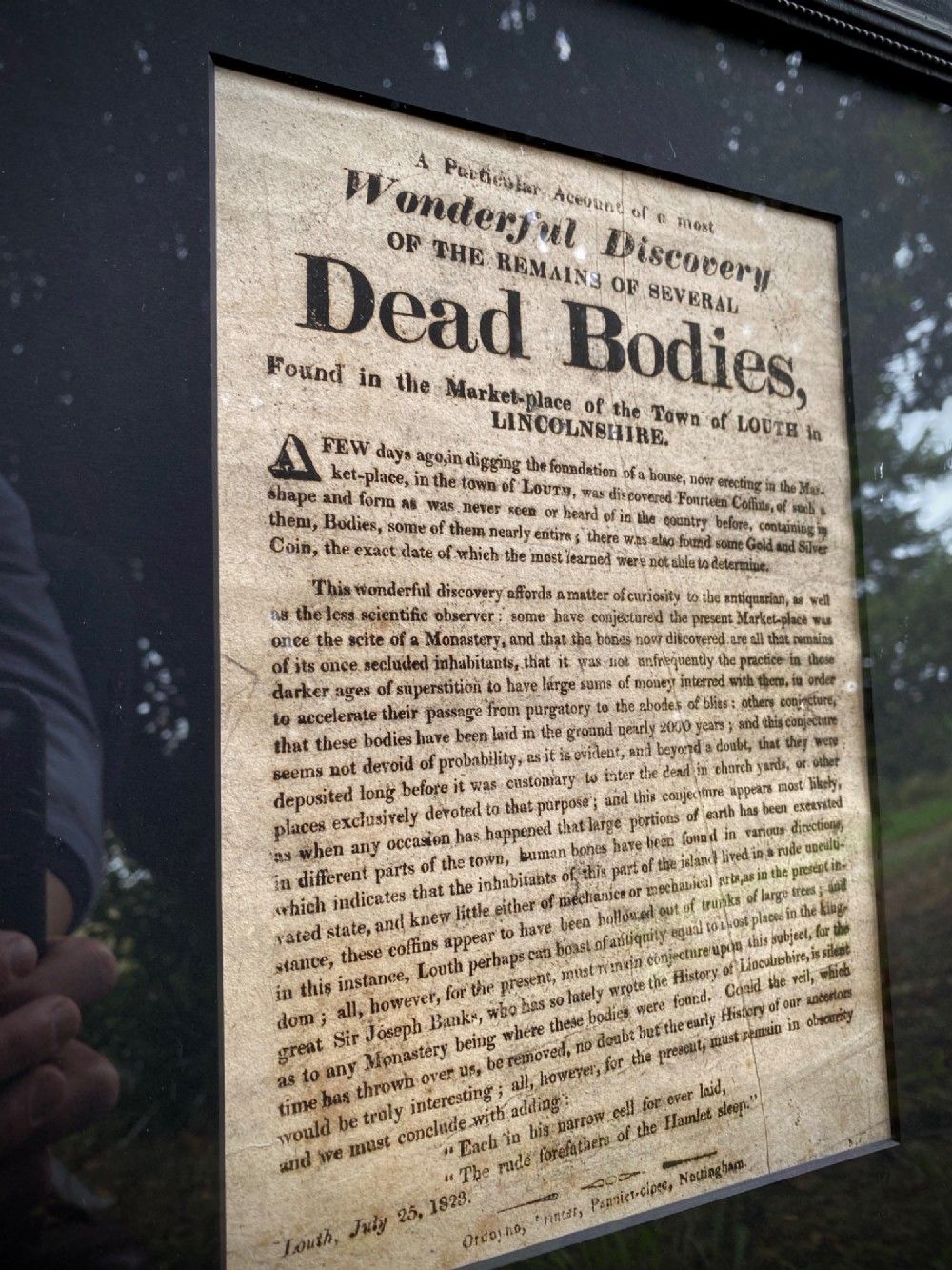 An 1823 letterpress printed broadside notice titled regarding a discovery in Louth Lincolnshire, presented in a dark ebonised wooden frame. View III
