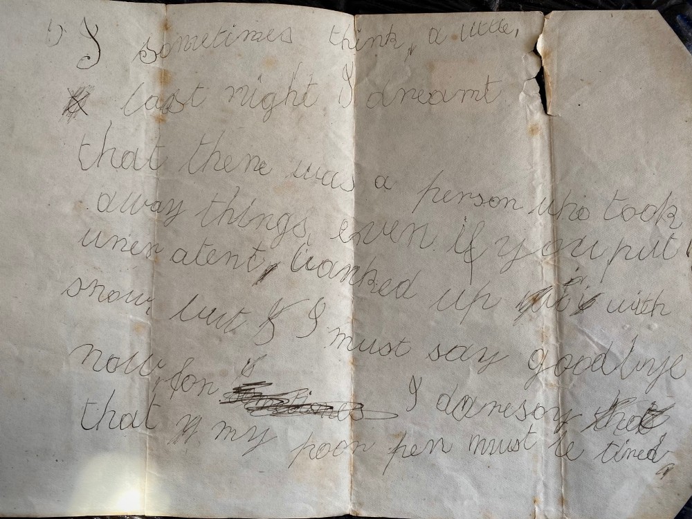 A folded 19th-century handwritten letter on creased cream paper with cursive script and a red Queen Victoria halfpenny postage stamp. View II