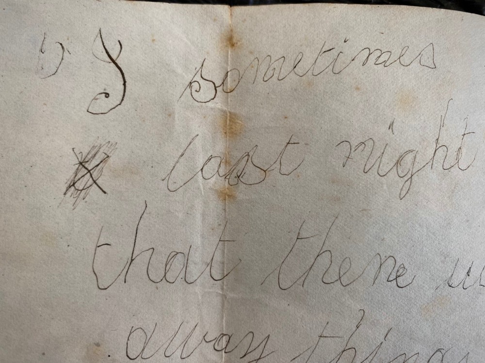 A folded 19th-century handwritten letter on creased cream paper with cursive script and a red Queen Victoria halfpenny postage stamp. View IV