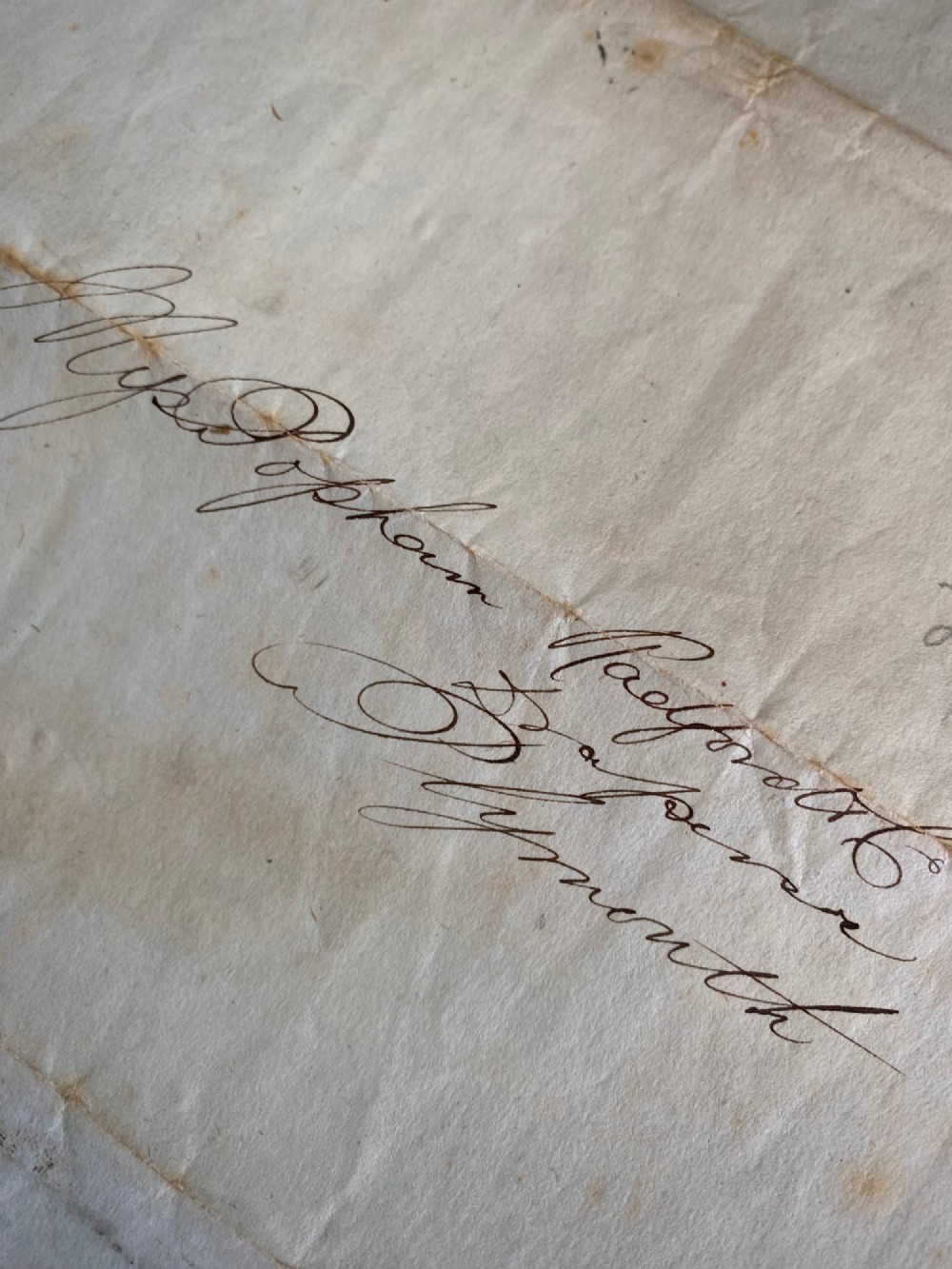 A folded 19th-century handwritten letter on creased cream paper with cursive script and a red Queen Victoria halfpenny postage stamp. View VII