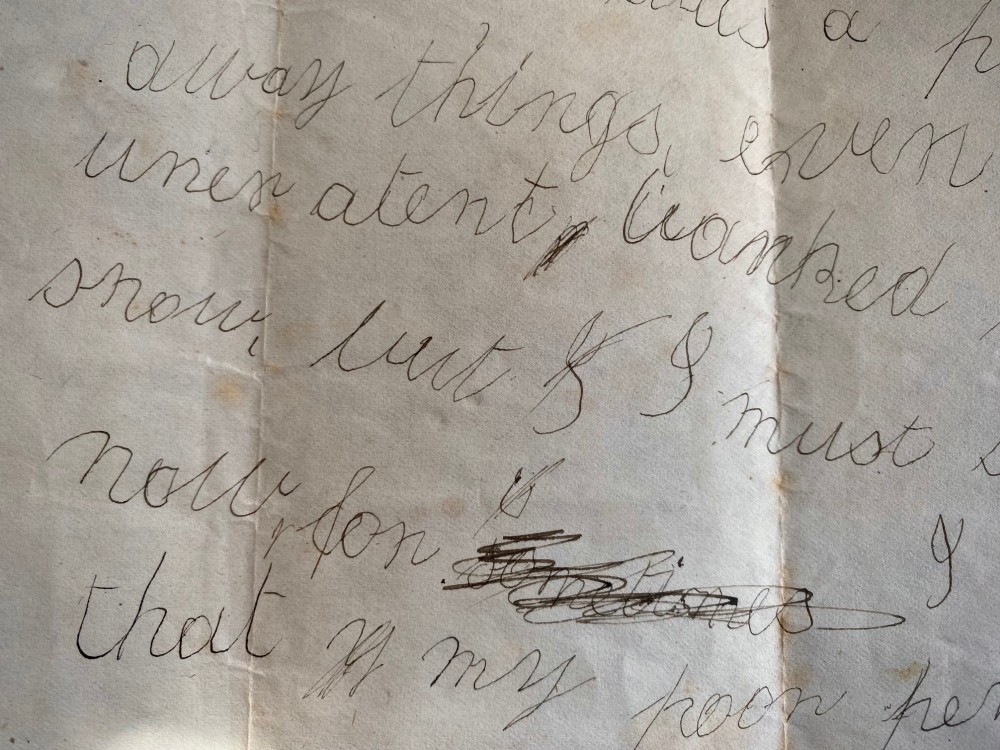 A folded 19th-century handwritten letter on creased cream paper with cursive script and a red Queen Victoria halfpenny postage stamp. View VIII