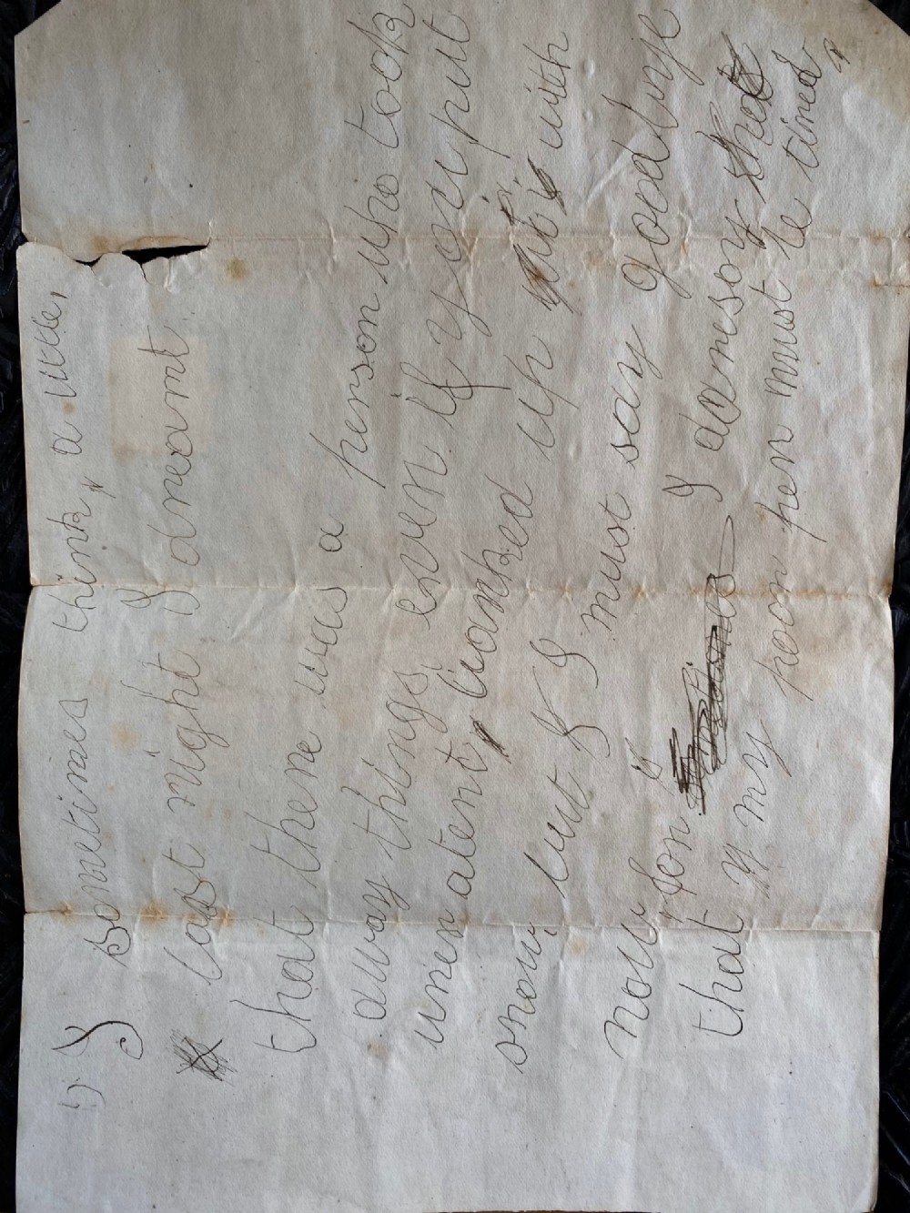 A folded 19th-century handwritten letter on creased cream paper with cursive script and a red Queen Victoria halfpenny postage stamp. View XI