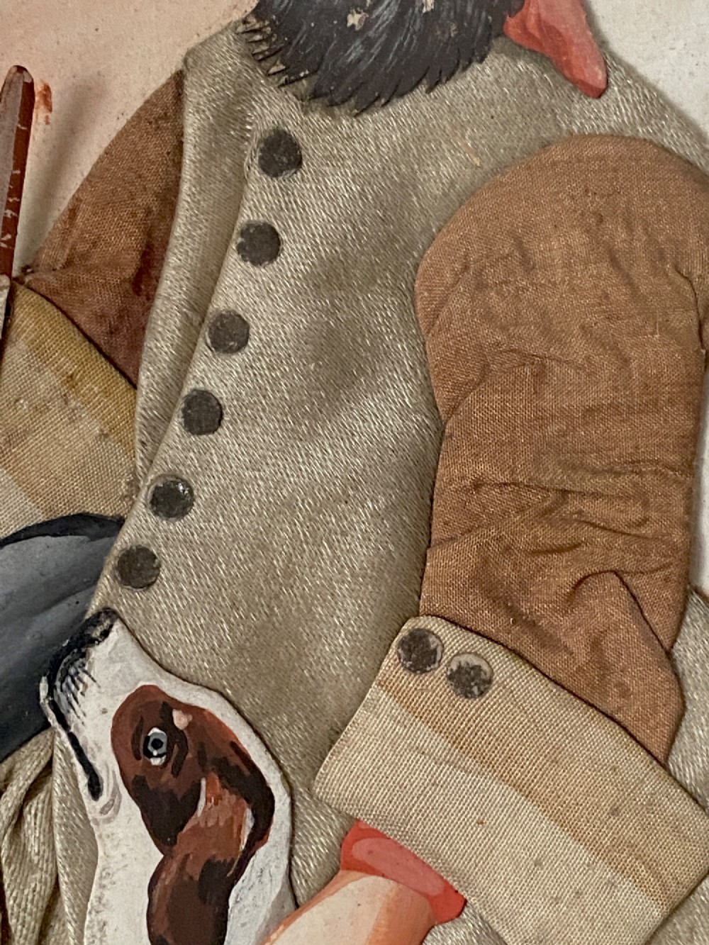 A late 18th-century Georgian folk art picture depicting a seated gamekeeper in fabric attire resting his hand on a spotted dog. View IV