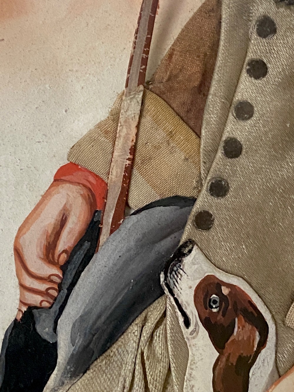 A late 18th-century Georgian folk art picture depicting a seated gamekeeper in fabric attire resting his hand on a spotted dog. View V